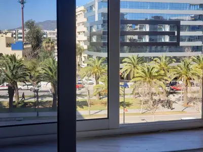 an open window with a view of palm trees at Luxurious apartment city center in Fès