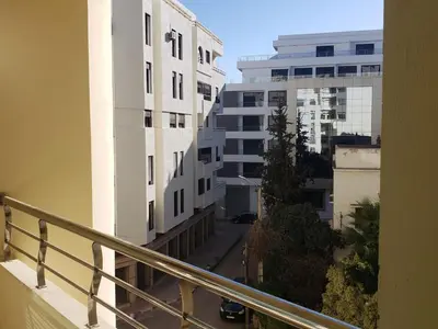 a view of a street from a balcony of a building at Luxurious apartment city center in Fès