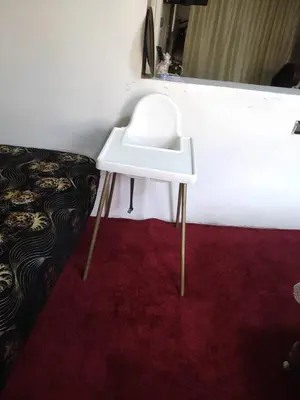 a white stool sitting on top of a red carpet at Amina appartement in Azrou