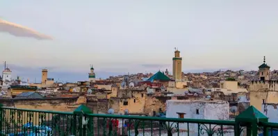 a view of a city with mosques and buildings at Riad Basma Fes - Tranquil Getaway in Fès