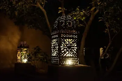 a couple of lights are lit up at night at Auberge Ibrahim in Agoudal