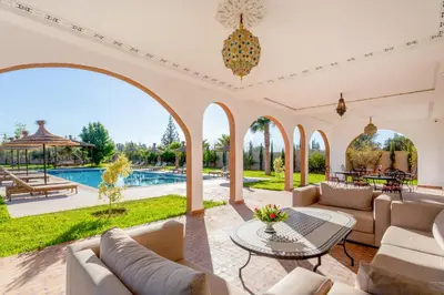 an estate with a swimming pool and a patio at Villa Leila Farmhouse in Marrakech