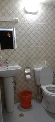 a bathroom with a toilet and a sink at Gite Skoura in Caïd Bou Malla