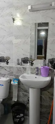 a bathroom with a sink and a mirror at Gite Skoura in Caïd Bou Malla
