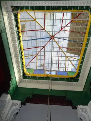 a stained glass window on the ceiling of a building at Riad Amimi Fes in Fès