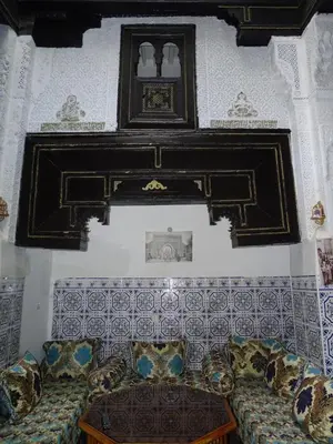 a living room with a couch and a table at Riad Amimi Fes in Fès