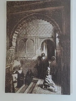an old picture of a group of people in a room at Riad Amimi Fes in Fès