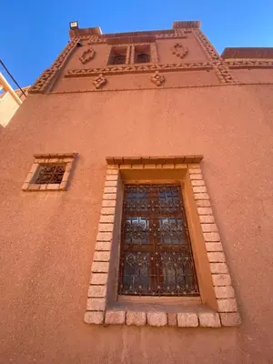 a window on the side of a building at Tafsut dades guesthouse stay with locals in Tamellalt