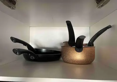 two utensils and a pan sitting on a counter at Magnifique appartement moderne (avec Wifi) in Fès