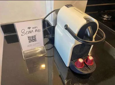 a toaster on a table with a sign on it at Magnifique appartement moderne (avec Wifi) in Fès