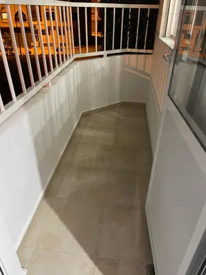 a balcony with a floor with a stair case at Magnifique appartement moderne (avec Wifi) in Fès