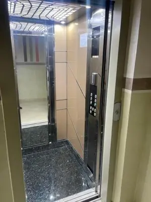 a shower in a bathroom with a glass door at Magnifique appartement moderne (avec Wifi) in Fès