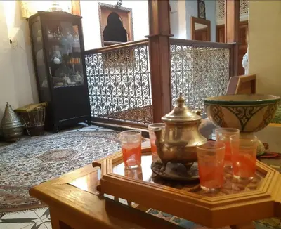 a room with a table with some drinks on it at Dar roeya in Fès