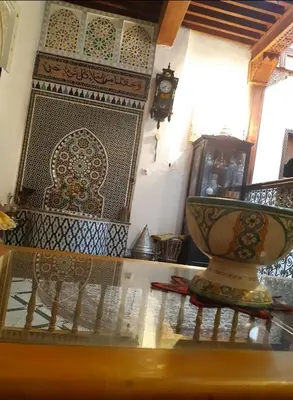a vase sitting on a table in a room at Dar roeya in Fès
