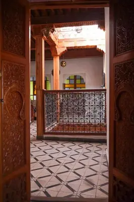 an open door to a room with a balcony at Dar roeya in Fès