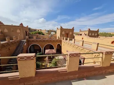 a view of a building with a bridge and buildings at Kasbah Ifri in Amdnarene
