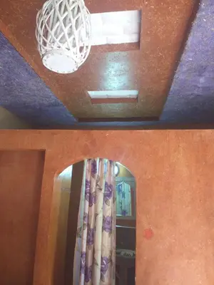 a room with a ceiling with a window and a mirror at Kasbah Ifri in Amdnarene