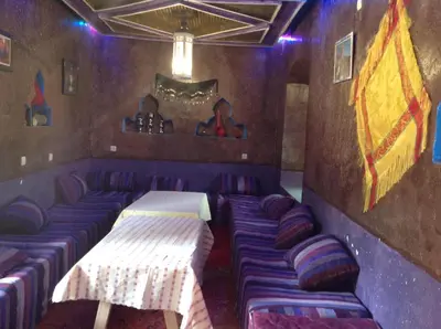 a purple room with couches and a couch in it at Kasbah Ifri in Amdnarene