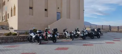 a row of motorcycles parked in front of a building at Gite Vanadenite in Midelt