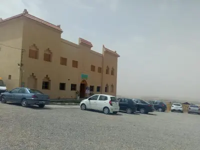 a group of cars parked in front of a building at Gite Vanadenite in Midelt