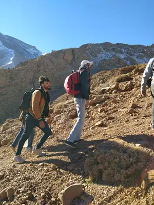 a group of people walking on a rocky mountain at Gite Vanadenite in Midelt