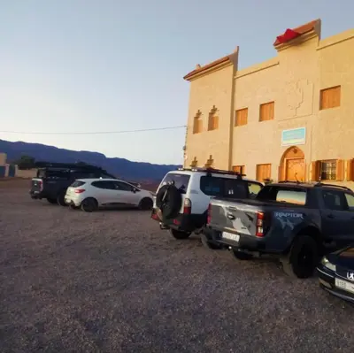 a group of cars parked in front of a building at Gite Vanadenite in Midelt