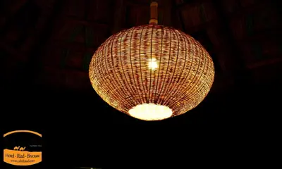 a chandelier hanging from the ceiling in a restaurant at Hotel Cafe Du Sud in Merzouga