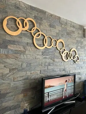 a large gold olympics sign hanging on a wall at MODERNE APPART PLEIN CENTRE in Fès