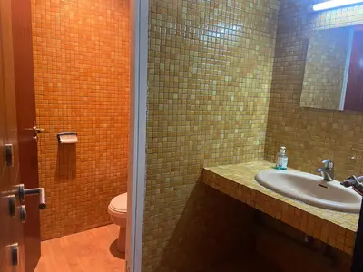 a bathroom with a sink and a toilet at MODERNE APPART PLEIN CENTRE in Fès
