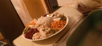 a bowl of food on a counter next to a sink at Gite Timit la maison Imazghn in Azilal