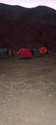 a group of tents sitting in a field at Gite Timit la maison Imazghn in Azilal