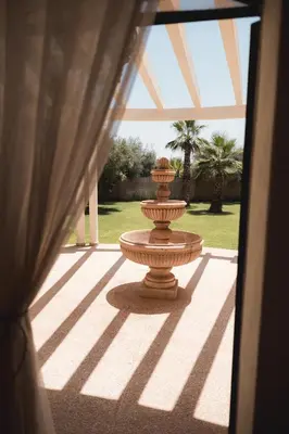 a large vase sitting in the middle of a patio at Villa Daïs - Marrakech in Marrakech