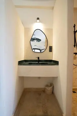 a bathroom with a sink and a mirror at Villa Daïs - Marrakech in Marrakech
