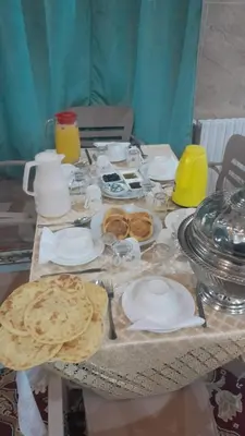 a table with plates and pastries on it at Hotel Opéra Azrou in Azrou