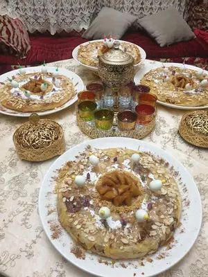 a table with many plates of food on it at Hotel Opéra Azrou in Azrou