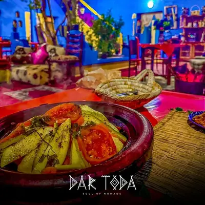 a bowl of food sitting on a table with vegetables at Dar Toda - Zagora guest house in Zagora