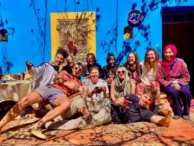 a group of people posing for a picture on a stage at Dar Toda - Zagora guest house in Zagora
