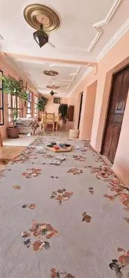 a large room with a large rug on the floor at Gite Tamounte in Tabant