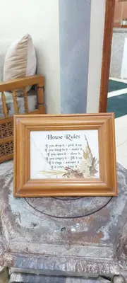 a picture frame with a picture of a house rules at Cozy Appartement in Midelt in Midelt