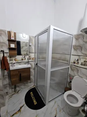 a bathroom with a shower with a toilet and a sink at Appartement In Ksar Ait Ben Haddou in Aït Ben Haddou