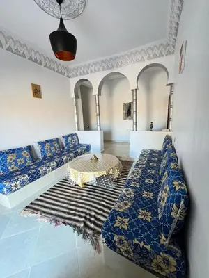 a living room with a couch and a table at Appartement In Ksar Ait Ben Haddou in Aït Ben Haddou