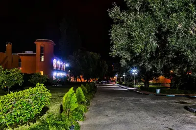 a building with blue lights on it at night at Complexe El Bassatine in Beni Mellal