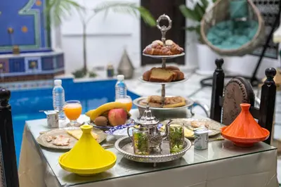 a buffet with food and drinks on a table at Palais Chahd Luxury in Fès