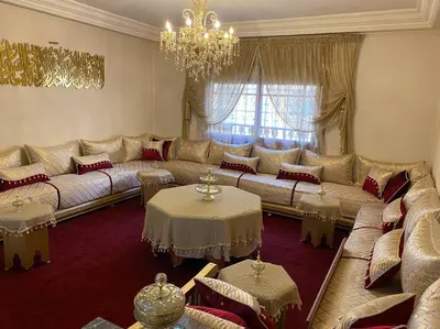 a living room with a large couch and tables at Cozy apartment near city center in Fès
