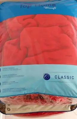 a close up of a package of classico on a bed at Bel appartement calme est bien équipé in Meknès