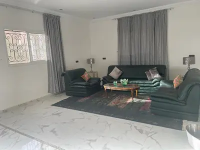 a living room with two couches and a coffee table at Amazing house separate of Villa with Swimming Pool in Marrakech