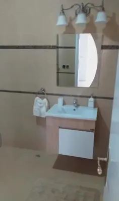 a bathroom with a sink and a mirror at Amazing house separate of Villa with Swimming Pool in Marrakech