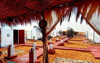 a view of a desert area with a tent at Rachid Luxury Camp in Merzouga