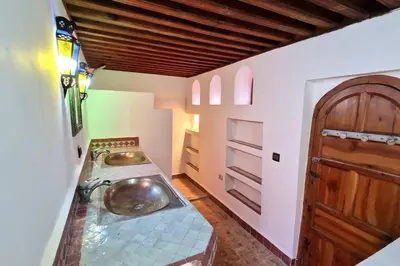 a bathroom with two sinks in a room at Entire Private House in Fez Medina! in Fès
