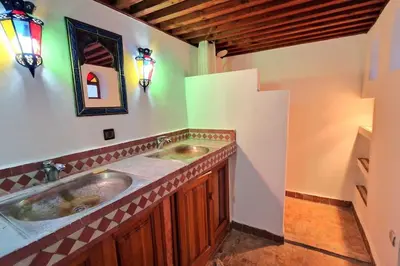 a bathroom with two sinks in a room at Entire Private House in Fez Medina! in Fès
